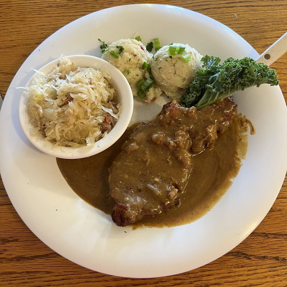 Der Lindenbaum - Schnitzel with mustard sauce, kraut amd potato salad. - German Near Me - Fredericksburg, Texas