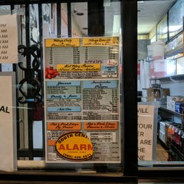 a menu in a window of a restaurant
