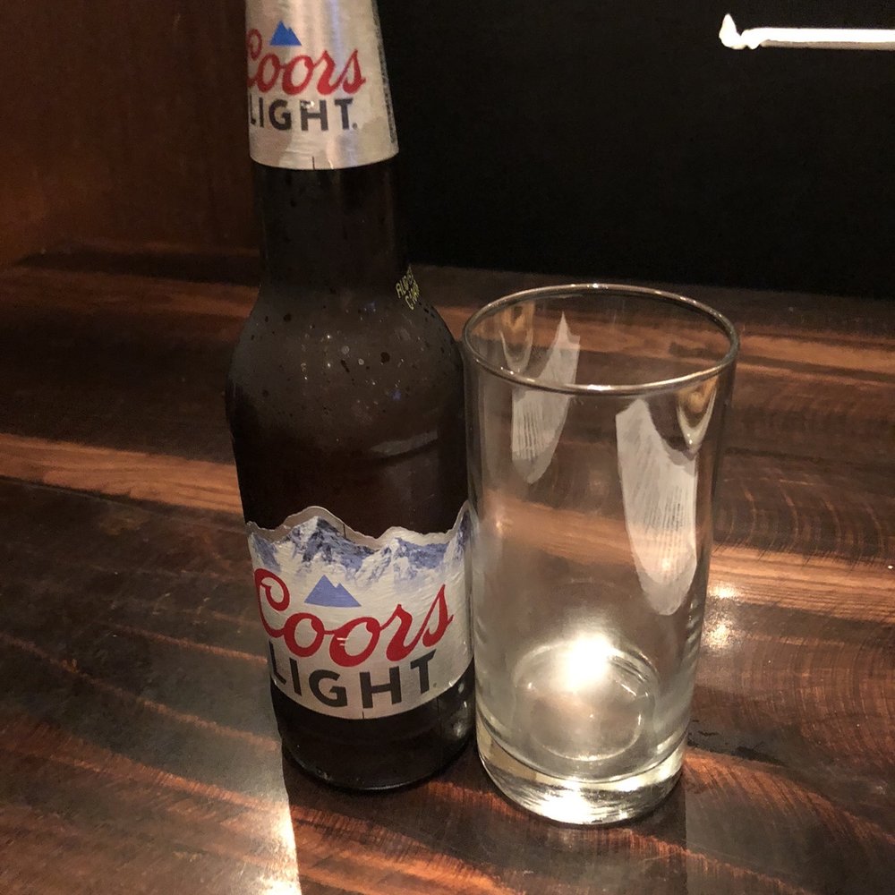 Xhibition Bar - a bottle of coors light next to a glass - Bars Near Me - Atlantic City, New Jersey Xhibition Bar - a bottle of coors light next to a glass - Bars Near Me - Atlantic City, New Jersey