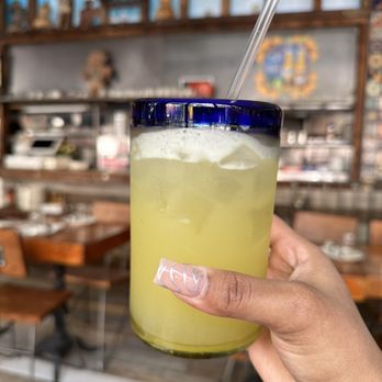 Sonora - a person holding a glass with a drink in it - Bars Near Me - Brooklyn, New York Sonora - a person holding a glass with a drink in it - Bars Near Me - Brooklyn, New York