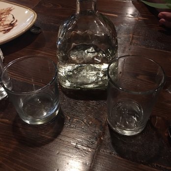 Cielito Lindo - Water in Tequila bottles.  Cool idea - New Mexican Cuisine Near Me - Medford, New Jersey