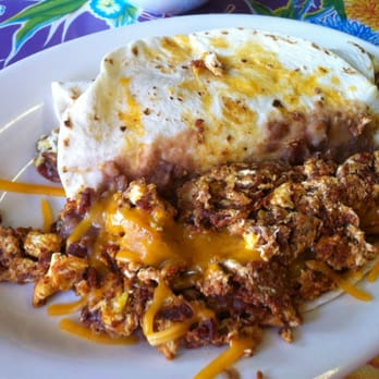El Jordan Cafe - Take a peak at the inside I a breakfast burrito w chorizo bacon egg beans and cheese - Tex-Mex Near Me - Dallas, Texas El Jordan Cafe - Take a peak at the inside I a breakfast burrito w chorizo bacon egg beans and cheese - Tex-Mex Near Me - Dallas, Texas