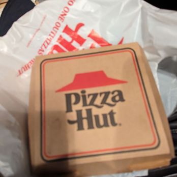 Pizza Hut - a box of pizza sitting on a car seat - Chicken Wings Near Me - Rolesville, North Carolina