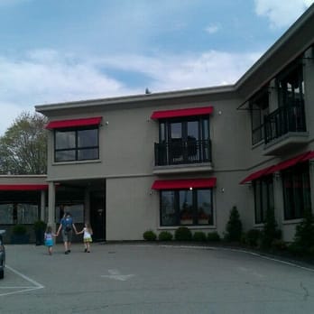George Delallo - the outside of a motel - Grocery Near Me - Mount Pleasant, Pennsylvania