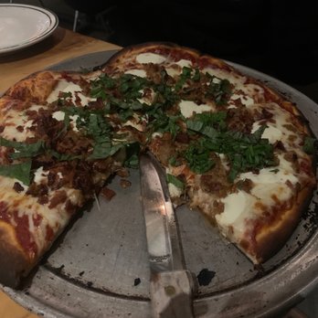 Piggy's Kitchen & Bar - Fresh Mozzarella & Basil added Italian sausage and bacon. - Breakfast & Brunch Near Me - Houston, Texas Piggy's Kitchen & Bar - Fresh Mozzarella & Basil added Italian sausage and bacon. - Breakfast & Brunch Near Me - Houston, Texas
