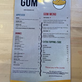 Gom Ramen - This is a small ma and pa shop like ramen place. First time here. - A menu from Gom Ramen in El Paso, TX, displaying sections for appetizers, drinks, ramen, and extra toppings. It includes items like Gom Ramen, Gom Tang, and various beverages such as lemonade and coffee. Prices are listed for each item, with options for spice levels and vegetarian choices. The menu emphasizes paying at the counter and encourages customer feedback. - Noodles Near Me - El Paso, Texas