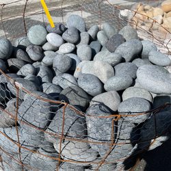 Broadmoor Landscape Supply - Rounded river rocks - gorgeous blue grey - bigger than your hand...