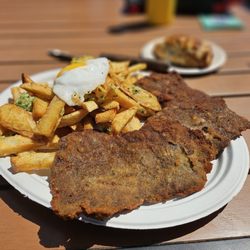 Tanguito Argentinean Grill - Milanesa classic and fries with garlic