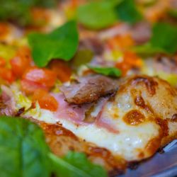 The Last Round Tavern - Cubano Pizza features our 14 hour braised pulled pork and house made Cubano sauce!