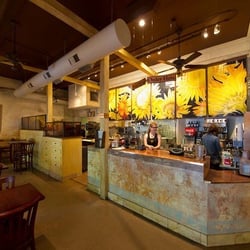 Roberta Ahrens Studio - Roberta Ahrens cracked linen Sunflower tapestries beautifully adorn the Adobe walls at Sunflower Caffé, Sonoma, Ca