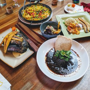 Oyo - Paella Oyo, island salmon, Oyo pepper pot, half jerk chicken, Calypso ceviche. - Latin American Near Me - Pleasanton, California
