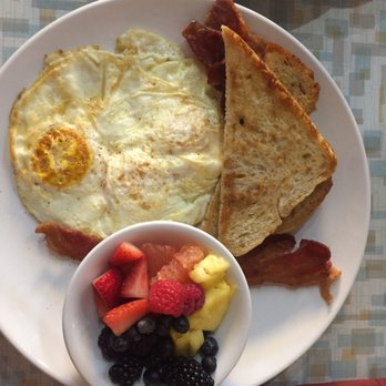 Aurora - The farmer - 3 eggs over medium, bacon, sourdough and a side of fruit. - Coffee & Tea Near Me - Oklahoma City, Oklahoma