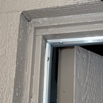 Light Emitting Electrical & Handyman Services - Paint pooling on corner, on metal frame - Plumbing Near Me