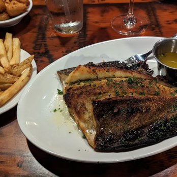 Capt. Anderson's Restaurant - Crab stuffed (too much breading) grilled flounder with French fries. - Seafood Near Me - Panama City Beach, Florida