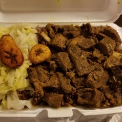 Caricom Spices Restaurant - Large goat stew with cabbage and plantains