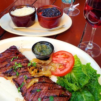 Norman's Tavern - Skirt Steak with Churrasco Sauce, salad, rice and beans - American Near Me - Miami Beach, Florida Norman's Tavern - Skirt Steak with Churrasco Sauce, salad, rice and beans - American Near Me - Miami Beach, Florida