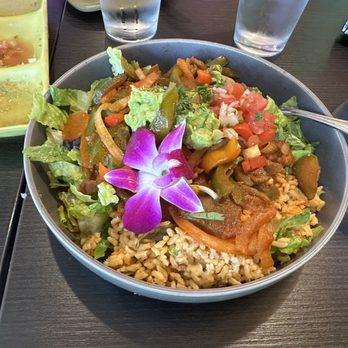 Quinoa Peruvian & Mexican Restaurant - Fajita bowl with edible orchid. - Mexican Near Me - Doylestown, Pennsylvania Quinoa Peruvian & Mexican Restaurant - Fajita bowl with edible orchid. - Mexican Near Me - Doylestown, Pennsylvania