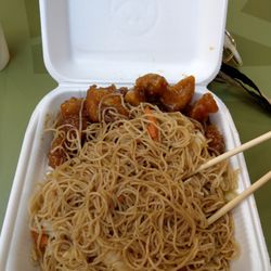 Orange chicken with rice noodles.