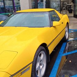 Orange Police Department - Yellow Corvette with no handicap placard parked in handicap space; owned by a barber at FIFTY50 Lounge Barbershop.