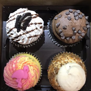 Gigi's Cupcakes - Top row left to right: double stuff, midnight magic Bottom row: Flamango (raspberry and mango swirl) and candy bar (butterfinger) - Desserts Near Me - Tampa, Florida