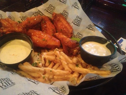 Photo of Tilted Kilt Pub & Eatery - Perimeter, GA, US. Sweet n spicy wings & fries w/ cheese sauce ... 3.5/5
