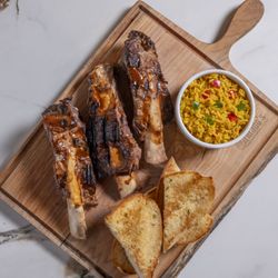 Grillado's - BBQ Ribs with rice and Garlic bread.