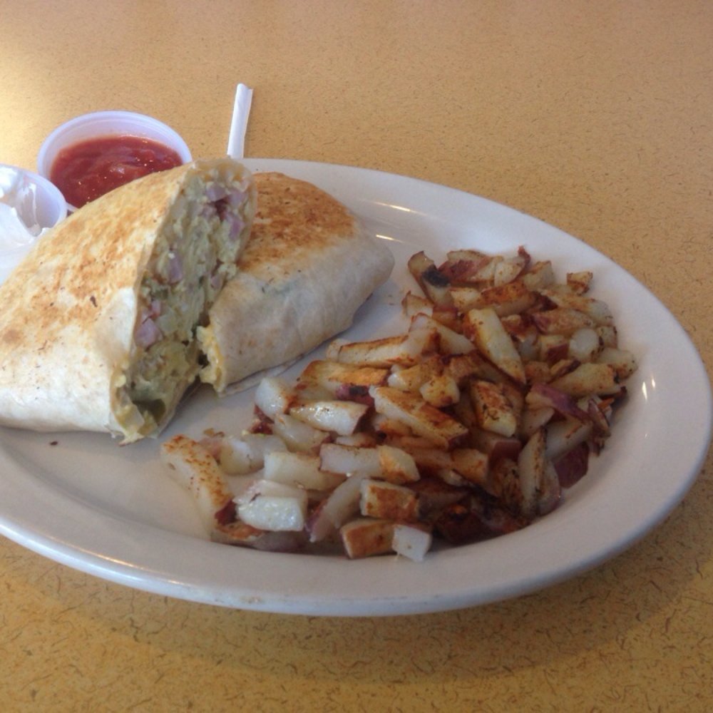 Breakfast burrito w/ home fries. Breakfast burrito w/ home fries.