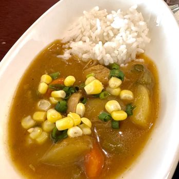 ANA Lounge - Hawaiian Chicken Curry w rice, and some green onion and corn added. I think JAL's curry is better. - Airport Lounges Near Me - 96819, Hawaii