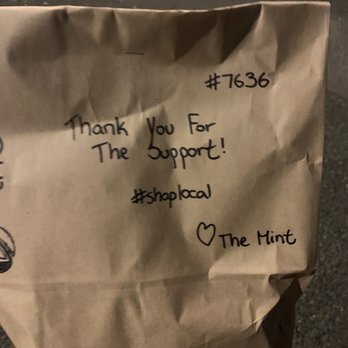 The Mint - a brown paper bag with writing on it - Asian Fusion Near Me - Victoria, British Columbia