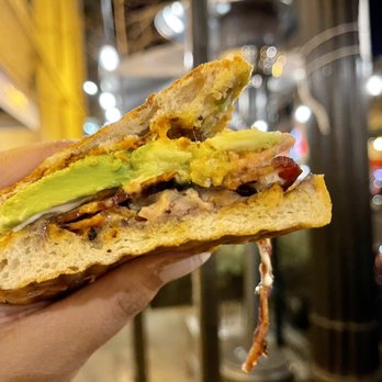Xoco - a person holding a sandwich in their hand - Mexican Near Me - Chicago, Illinois Xoco - a person holding a sandwich in their hand - Mexican Near Me - Chicago, Illinois
