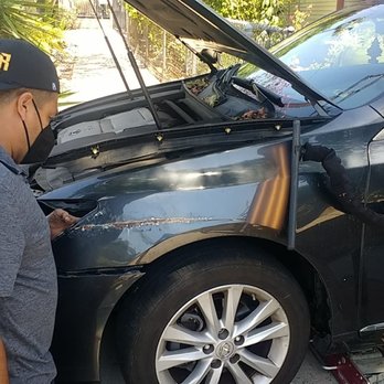 Premier Paintless Dent Repair - Working the dent from behind to push out the dent/scrape. - Mobile Dent Repair Near Me - South Bend, Indiana Premier Paintless Dent Repair - Working the dent from behind to push out the dent/scrape. - Mobile Dent Repair Near Me - South Bend, Indiana