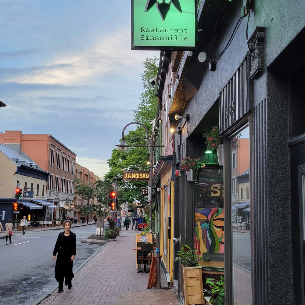 Sinsemilla - a woman walking down a sidewalk - Seafood Near Me - Quebec City, Quebec Sinsemilla - a woman walking down a sidewalk - Seafood Near Me - Quebec City, Quebec