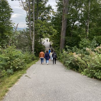 Bank NH Pavillion - a group of people walking down a path - Music Venues Near Me - Gilford, New Hampshire Bank NH Pavillion - a group of people walking down a path - Music Venues Near Me - Gilford, New Hampshire