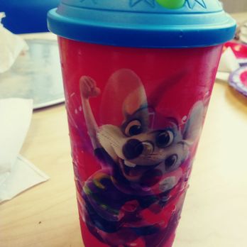 Chuck E. Cheese - a red cup with a blue lid and a green straw - Pizza Near Me - Houston, Texas