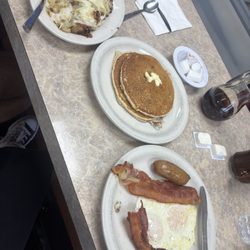 The Terminal Restaurant - Homefries (cheese added) pancakes, eggs over easy, bacon and sausage
