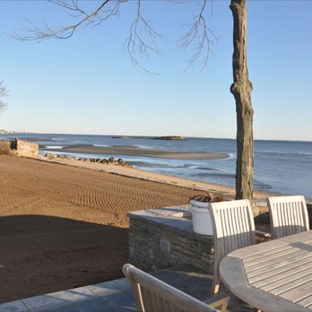Labriola Landscaping - a table and chairs on the beach - Landscaping Near Me - Westbrook, Connecticut Labriola Landscaping - a table and chairs on the beach - Landscaping Near Me - Westbrook, Connecticut