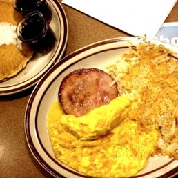 two plates of breakfast food on a table two plates of breakfast food on a table