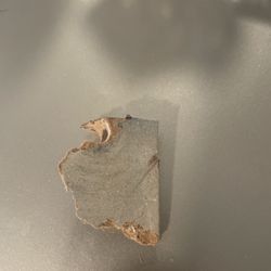 Xpress Moving & Logistics - Chunk of dresser damage due to likely over tightening the feet