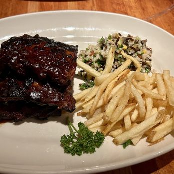 Houston's Restaurant - There are 2 more slabs of ribs under the top one + Wild Rice Salad. Ribs had good flavor, falling-off-the-bone tender. - New American Near Me - Scottsdale, Arizona