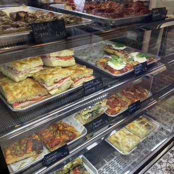 Nonnina - a variety of pizzas in a display case - Ice Cream & Frozen Yogurt Near Me - Lachine, Quebec Nonnina - a variety of pizzas in a display case - Ice Cream & Frozen Yogurt Near Me - Lachine, Quebec