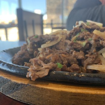 Korean Garden - beef and onions on a black plate - Korean Near Me - Colorado Springs, Colorado Korean Garden - beef and onions on a black plate - Korean Near Me - Colorado Springs, Colorado