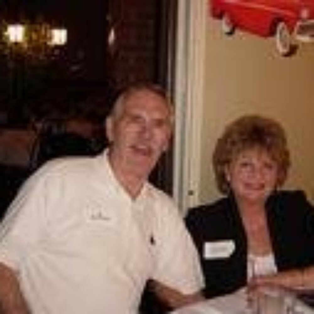 Carpet Direct - a man and a woman sitting at a table - Carpet Installation Near Me - Loveland, Colorado