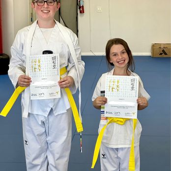 Excel Taekwondo Academy - Working together to earn their new belts. - Taekwondo Near Me - Upland, California Excel Taekwondo Academy - Working together to earn their new belts. - Taekwondo Near Me - Upland, California