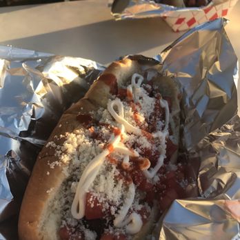 Estilo Mexico Hot Dogs - Bacon wrapped hot dog with grilled onions grilled jalapeños fresh diced tomatos cream and tapatio - Street Vendors Near Me - San Jose, California Estilo Mexico Hot Dogs - Bacon wrapped hot dog with grilled onions grilled jalapeños fresh diced tomatos cream and tapatio - Street Vendors Near Me - San Jose, California