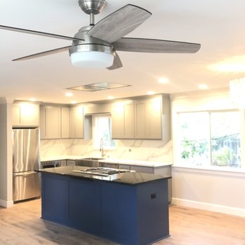 De Loza Construction - a kitchen with a ceiling fan - General Contractors Near Me