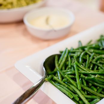The Arlington - a plate of green beans on a table - Caterers Near Me The Arlington - a plate of green beans on a table - Caterers Near Me