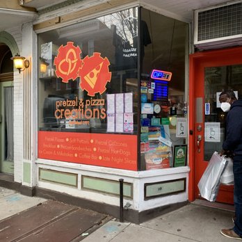 Pretzel & Pizza Creations - a man standing in front of a store - Pizza Near Me - Frederick, Maryland Pretzel & Pizza Creations - a man standing in front of a store - Pizza Near Me - Frederick, Maryland