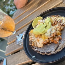 a plate of food and a glass of beer