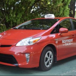 Independent Taxi Service - Toyota Prius in action helping all people get around town.