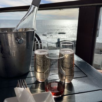 The Rooftop Lounge - Bubbles with pama pomegranate liquor - Lounges Near Me - Laguna Beach, California The Rooftop Lounge - Bubbles with pama pomegranate liquor - Lounges Near Me - Laguna Beach, California